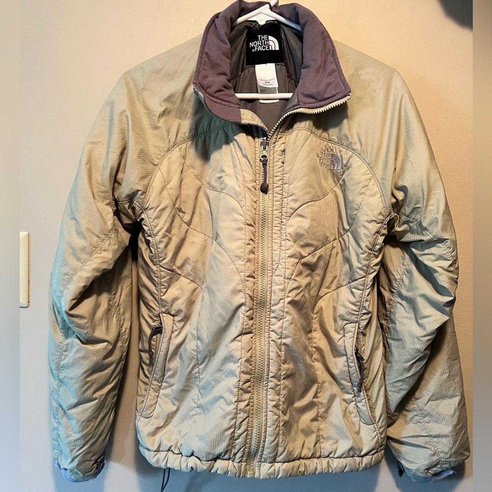 The North Face size M sage green winter jacket with grey color and interior.